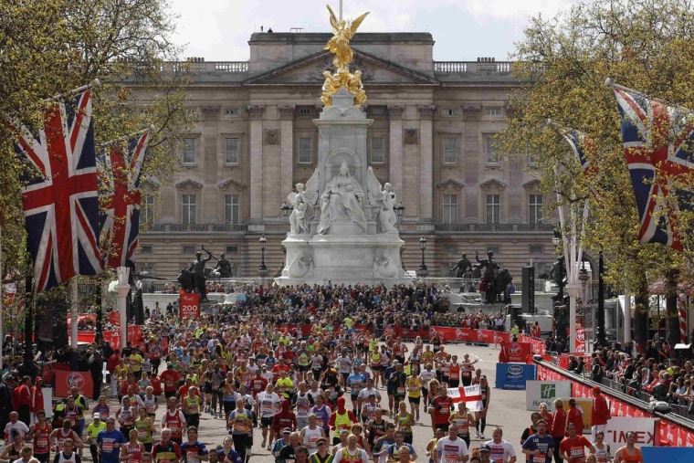 Runners approach the finish line at Buckingham Palace in the London Marathon on April 22, 2012.